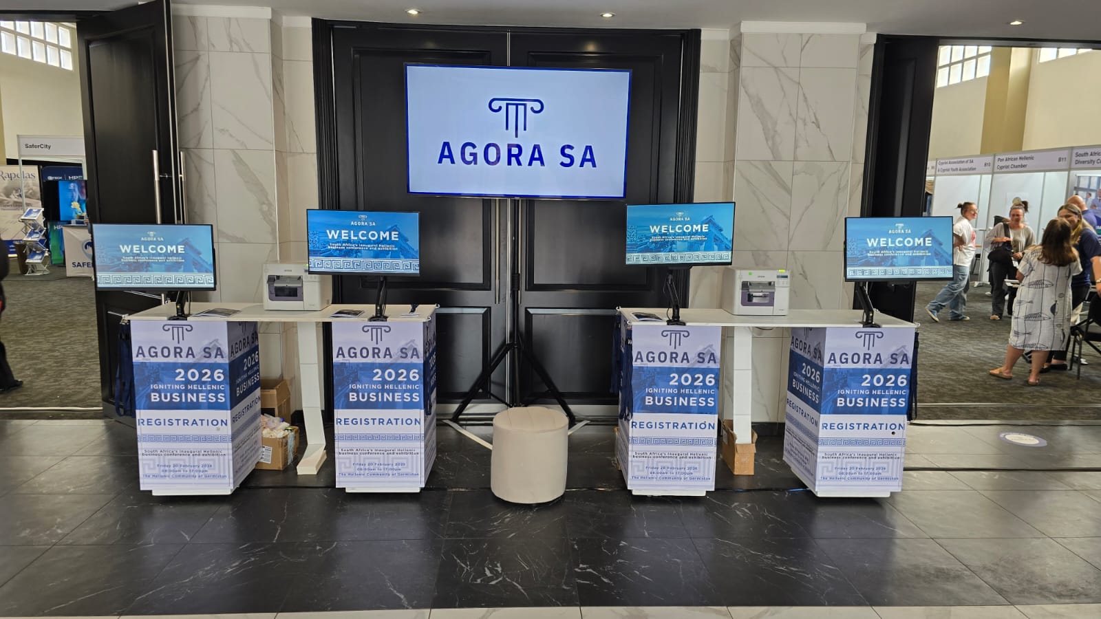 Branded AFRIREG touchscreen registration kiosks at Agora SA 2026